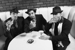 three guys having a party drinking cocktails and smoking